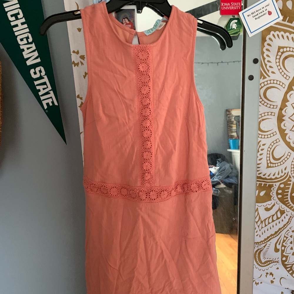 Francesca’s peachy coral dress